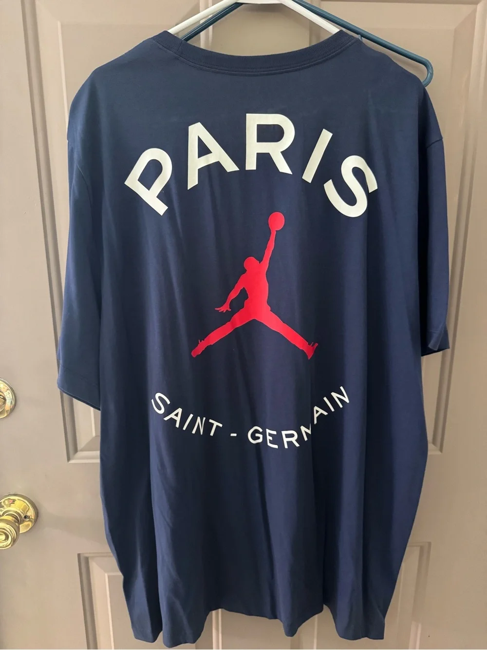 Jordan Men’s Navy Short Sleeve PSG Logo Tee with Red Jumpman